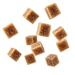 Brown sugar cubes scattered against a transparent background