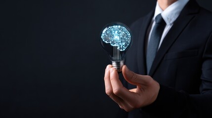Businessman holds lightbulb with glowing circuit brain inside.
