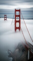 Iconic Golden Gate Bridge Towers Emerge from Thick Fog.