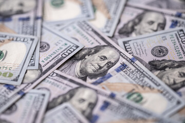 Money background with 100-dollar bills. Texture of US money currency. 100 USD banknotes in focus. American hundred-dollar money for banner. Pattern of US dollars. Money for finance concept.