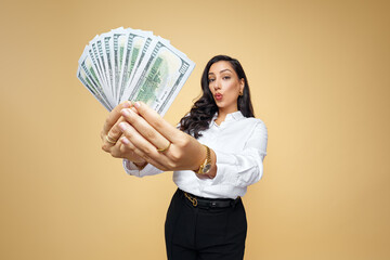 Jackpot entrepreneur, economist, banker, chic, elegant businesswoman showing bonus money to the camera, jacket concept. Attractive, confident, shrewd, clever, wealthy luxury woman.