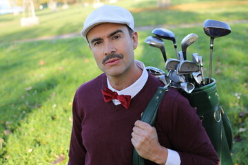 Handsome elegant golfer with a mustache 