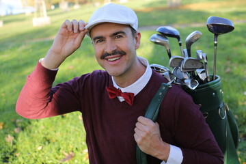 Golf player adjusting his hat during a sunny day 