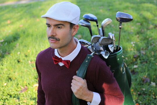 Handsome caddie in the golf club 