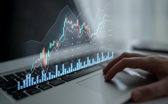 A laptop displays a digital stock market analysis with vibrant graphs and data overlays, capturing the essence of modern financial investment strategies in a professional setting. Scalp - Powered by Adobe