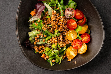 Lentil salad vegetables, tomato, green leaf lettuce tasty snack fresh delicious gourmet food table setting rustic top view copy space keto and paleo diet vegetarian and vegan food