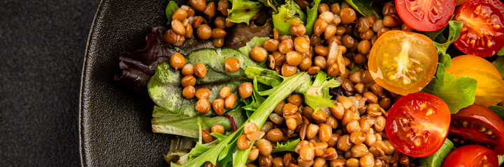 Lentil salad vegetables, tomato, green leaf lettuce tasty snack fresh delicious gourmet food table setting rustic top view copy space keto and paleo diet vegetarian and vegan food