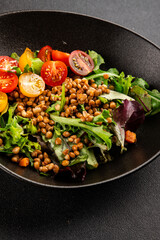 Lentil salad vegetables, tomato, green leaf lettuce tasty snack fresh delicious gourmet food table setting rustic top view copy space keto and paleo diet vegetarian and vegan food