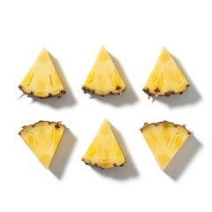 Naklejka premium Six triangular slices of fresh ripe pineapple arranged in two rows isolated on white background