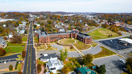 Historic brick school building in a small town during the fall 