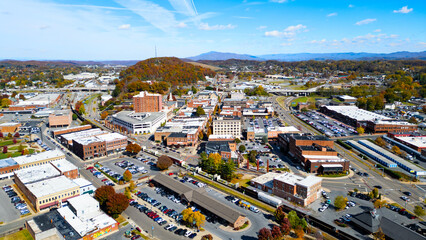 Aerial view of downtown Johnson city with train and fall foliage 