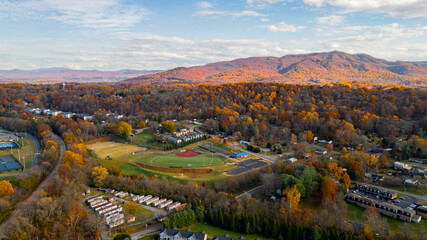 Beautiful fall colors on mountains with sports fields 