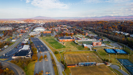 Beautiful fall day with sports fields and fall colors mountains in distance 