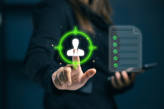 Business concept of target audience and customer focus. A businesswoman selecting user profile icon with virtual checklist. Concept of marketing strategy, recruitment, and human resources.