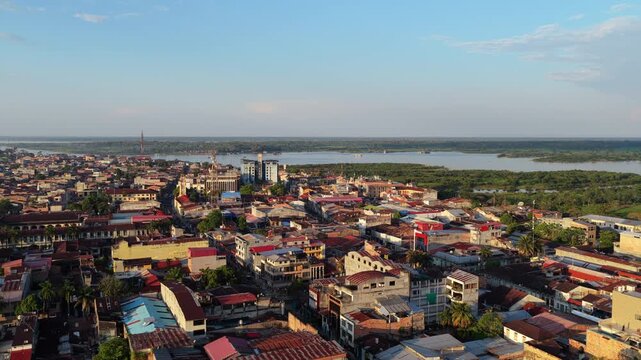 Aerial footage of Iquitos, largest city in the Peruvian Amazon, showcasing architecture and urban layout at sunset with rainforest background