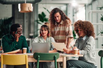 Diverse startup team collaborating during an office meeting