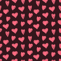 Seamless vector pattern with hearts drawn with a red marker on a dark background