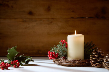 White candle with natural holly berries
