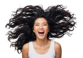 Joyful asian woman with long flowing hair laughing heartily isolated on transparent background