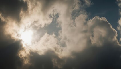 Obraz premium Dramatic Sun Rays Breaking Through Dark Storm Clouds in a Cloudy Sky.