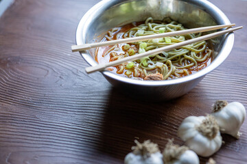 Close-Up of Spicy Tuna Ramen in a Metal Bowl – Traditional Japanese Dish
