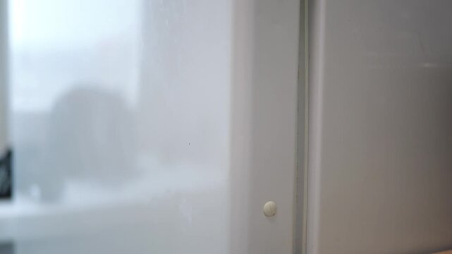 Refrigerator Door Opening with Silicone Suction Pads Softening Impact and Filling Gaps, Interior Revealing Food Items without Light, Subtle Splashing Sounds, Household Energy Concept, Power Outage Sce