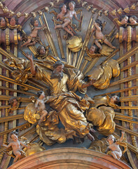 Fototapeta premium SALZBURG, AUSTIRA - SEPTEMBER 7, 2025: The carved polychrome statue of God the Creator from main altar in the church Franziskanerkirche by Johann Bernhard Fischer von Erlach (1709 - 1710)
