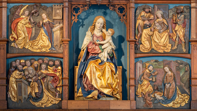 SALZBURG, AUSTIRA - SEPTEMBER 8 2025: The carved polychrome new gothic altar of Madonna in chapel Margarethenkapelle by unknown artist. 