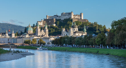 Obraz premium Salzburg - The panorama of old town from the river side in evening light. 