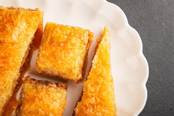 Baklava with pistachios and almonds dessert oriental sweets natural product tasty snack fresh delicious gourmet food background on the table rustic top view copy space