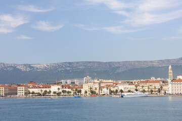 Fototapeta premium Scenic Coastal View of a Mediterranean Town With Mountains and Waterfront, Split, Croatia