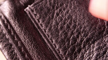 Black Tanned Leather with Stitched Lines Being Scratched and Checked by Artisan Finger, Close Up Hand Motion Detail, Craftsmanship Quality Inspection, Precise Material Handling, Leatherwork Maintenanc