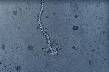 Cold Winter Frost Background frozen on Glass