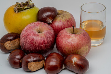 A composition of typically autumnal fruits such as chestnuts, persimmons or the Campanian Annurca apple, enhancing their beauty and detail.