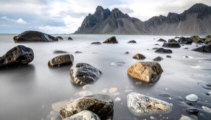 Vestrahorn Mountain Reflection in Icelands Calm Coastal Waters.