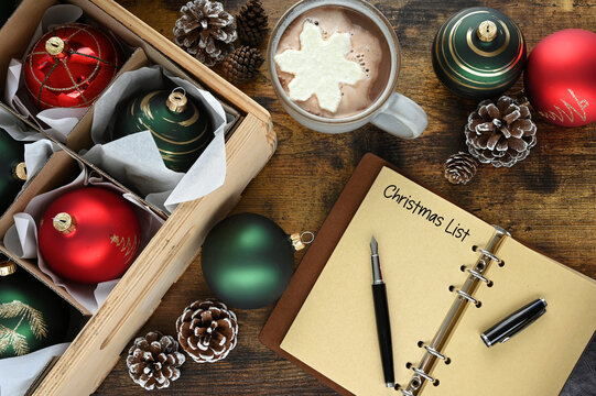 Writing a Christmas List with decorations and hot chocolate cocoa