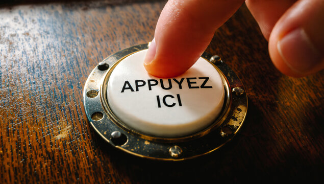 Doigt appuyant sur un bouton APPUYER ICI, style vintage