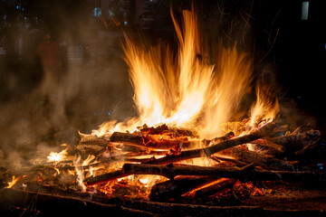 Long exposure shot of logs on fire with the flames smoothened out showing the celebration of the...