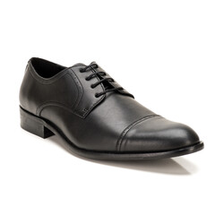 Close-up of a single black leather dress shoe isolated on a clean white background. Professional studio lighting ideal for advertising, fashion, or e-commerce product display.