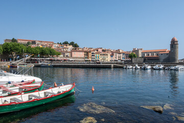 Obraz premium View of colourful Collioure, narrow streets and yellow, pink, orange houses, summer vacation destination town with historical buidings and beaches, Pyrenees-Orientales, France