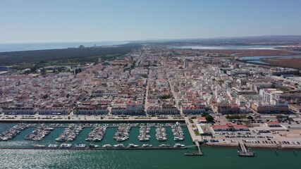 Aerial view shot of Vila Real de Santo Antonio Portugal Guadiana river meets Atlantic coast Marshes and lagoons along river estuary, Aerial perspective of estuarine surroundings at Guadiana river