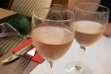 Lunch in french bistro with glass of cold rose wine in summer, Toulouse, France