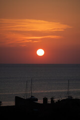 Pink sunrise over sea and colourful houses of Collioure, Cote Vermeille, Pyrenees-Orientales, Occitania, France. Summer vacation destination