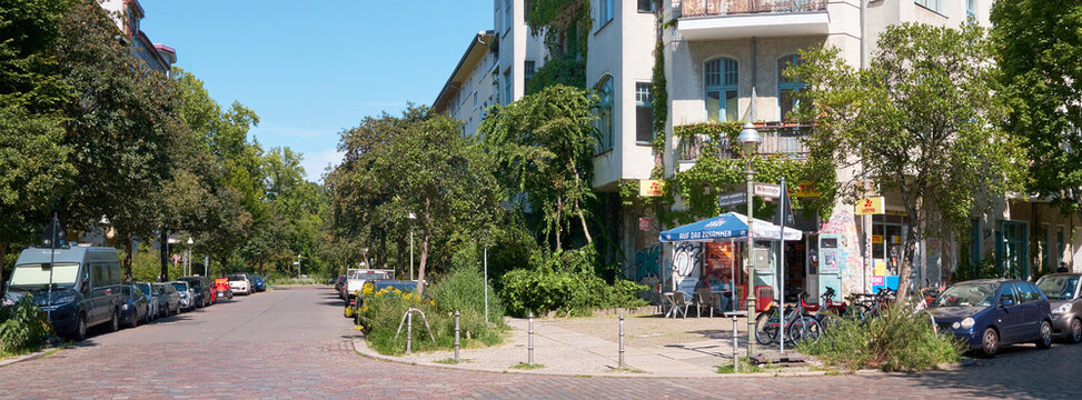 Berlin, Germany, August 12, 2025, summery city idyll in Kreuzberg with a parasol in front of the kiosk and lottery store on the corner of Wilmsstrasse and Tempelherrenstrasse