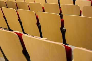 Empty auditorium seats in staggered rows waiting for audience