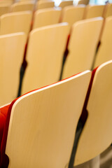 Empty auditorium chairs creating patterns and lines