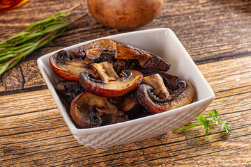 Fried champignon slices in the plate