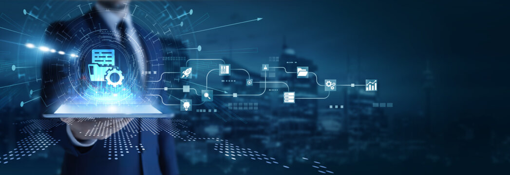 Businessman analyzing using tab data on document management. File organization, workflow automation, cloud storage, data security, and enterprise information handling.