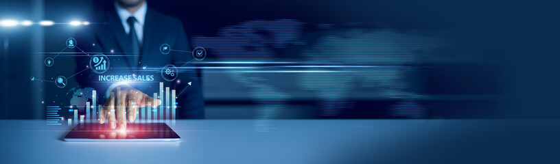 Businessman using tablet analyzing increase sales performance and growth graph chart, marketing...