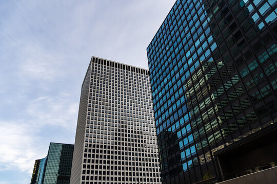 Modern architecture of downtown Chicago skyscrapers against a blue sky